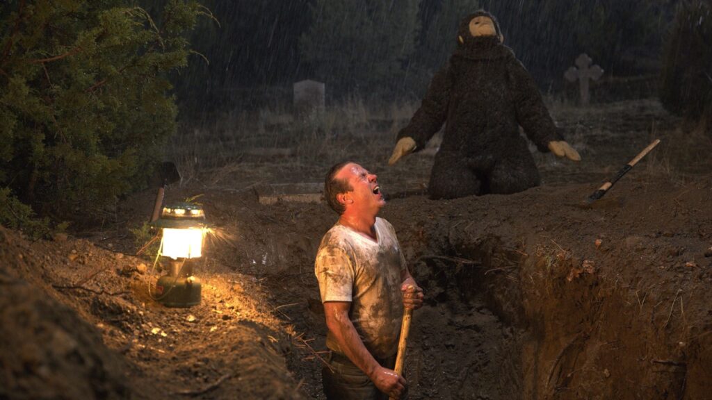 Roy as he digs up his dead father
