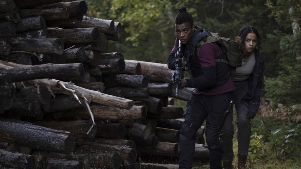 Emanuel and Dawn stealthily making their way through the woods