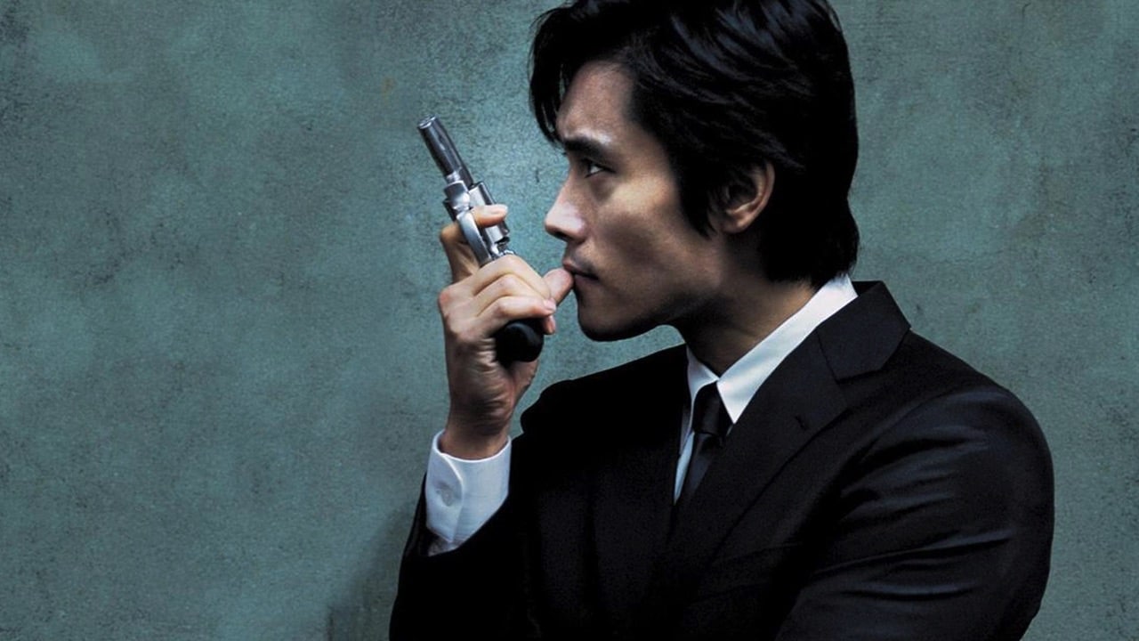 Profile shot of Seon-woo holding a gun