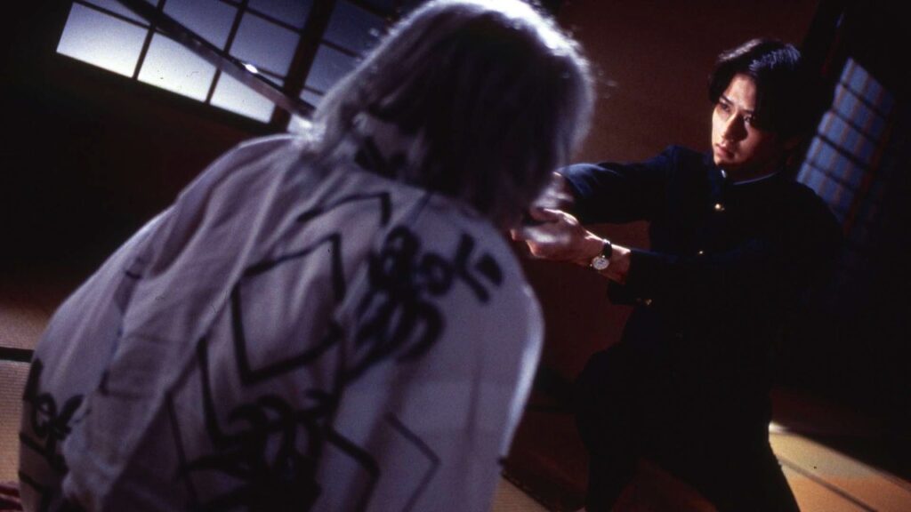 Riki wielding a sword