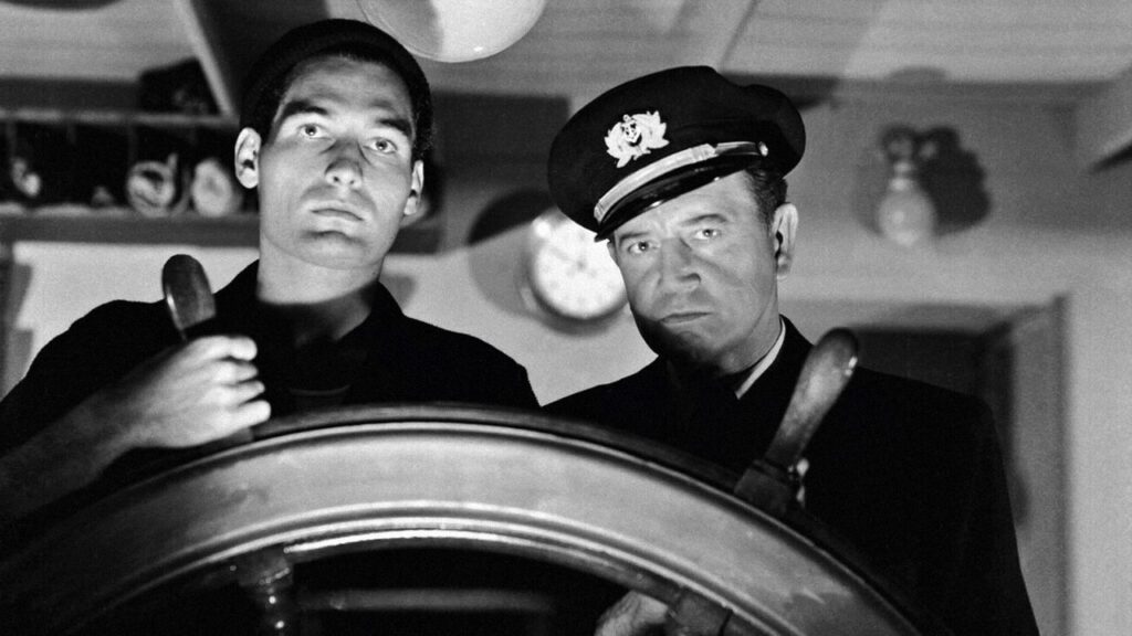 Tom Merriam on the bridge with Captain Stone