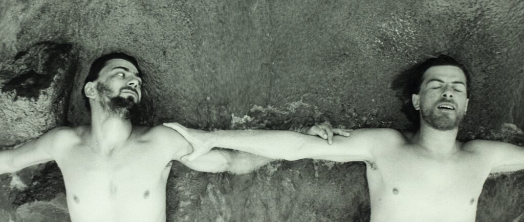 Ondrej and Armin lie naked in the sea together