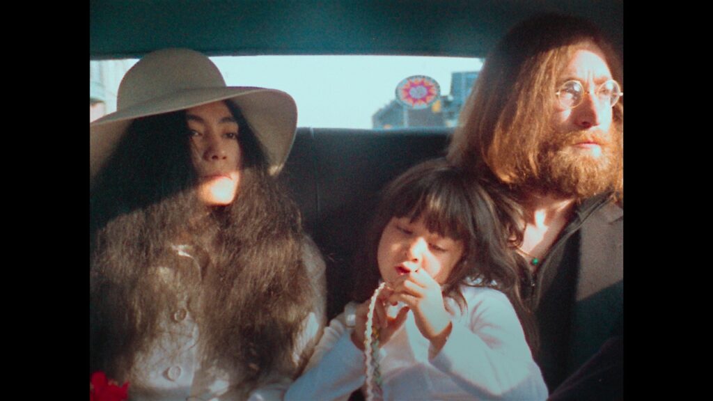The Lennon Ono family in the back of a limo