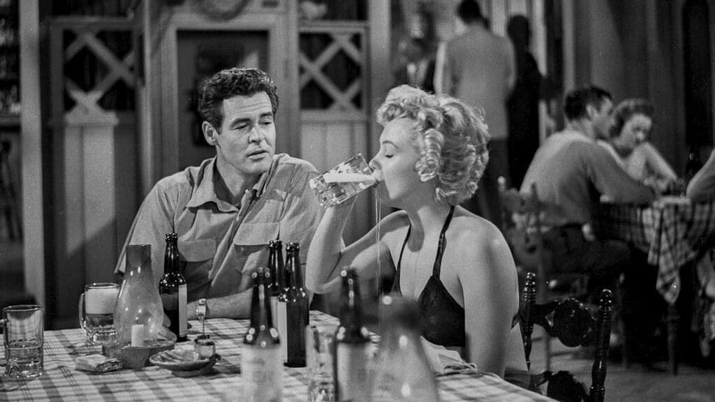 Earl watches while Peggy drinks a beer