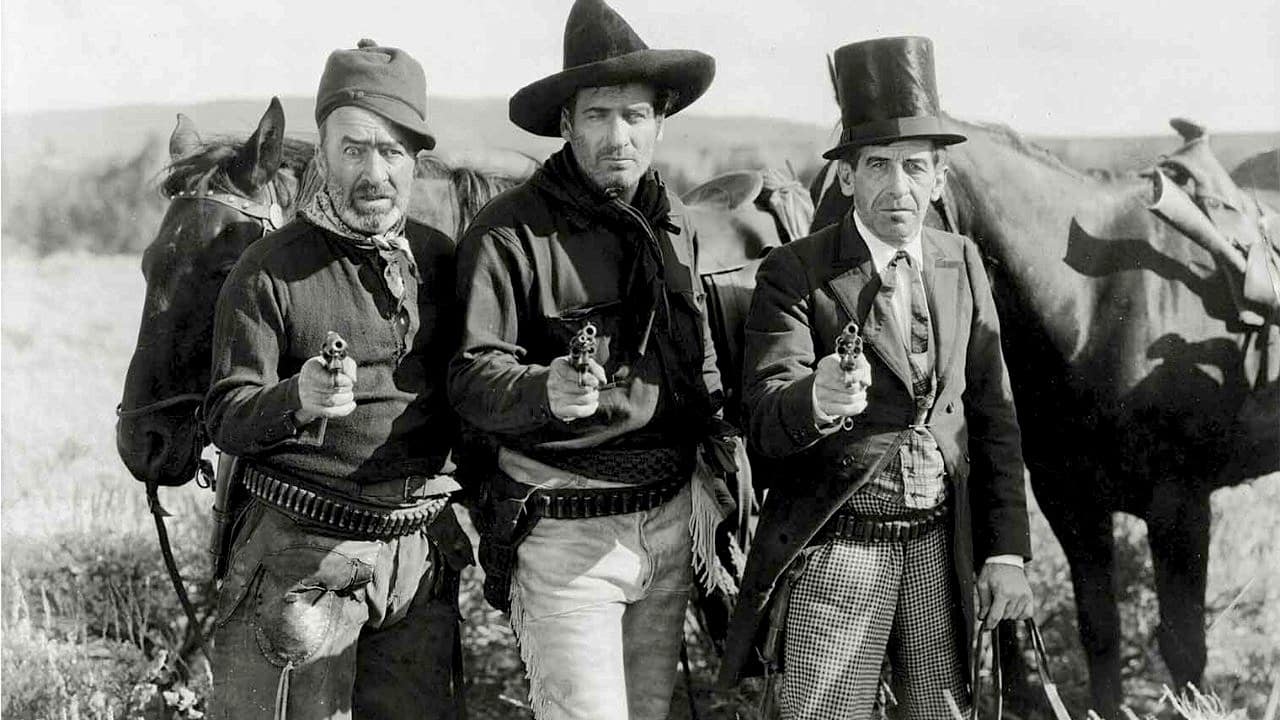 The three bad men point their guns at the camera