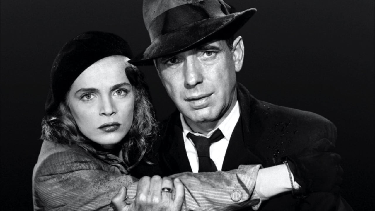 Lizabeth Scott and Humphrey Bogart stare straight into camera