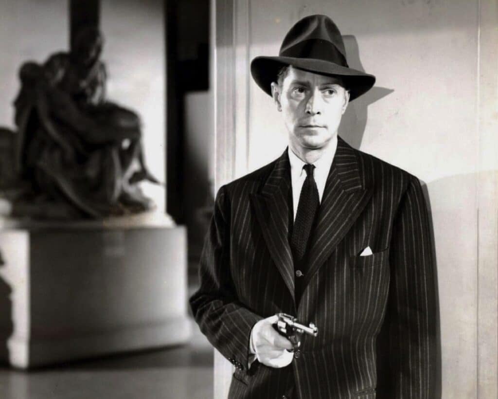 Franchot Tone with gun drawn