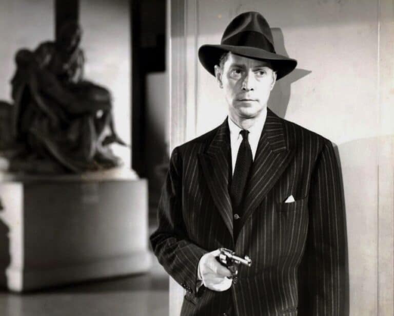 Franchot Tone with gun drawn