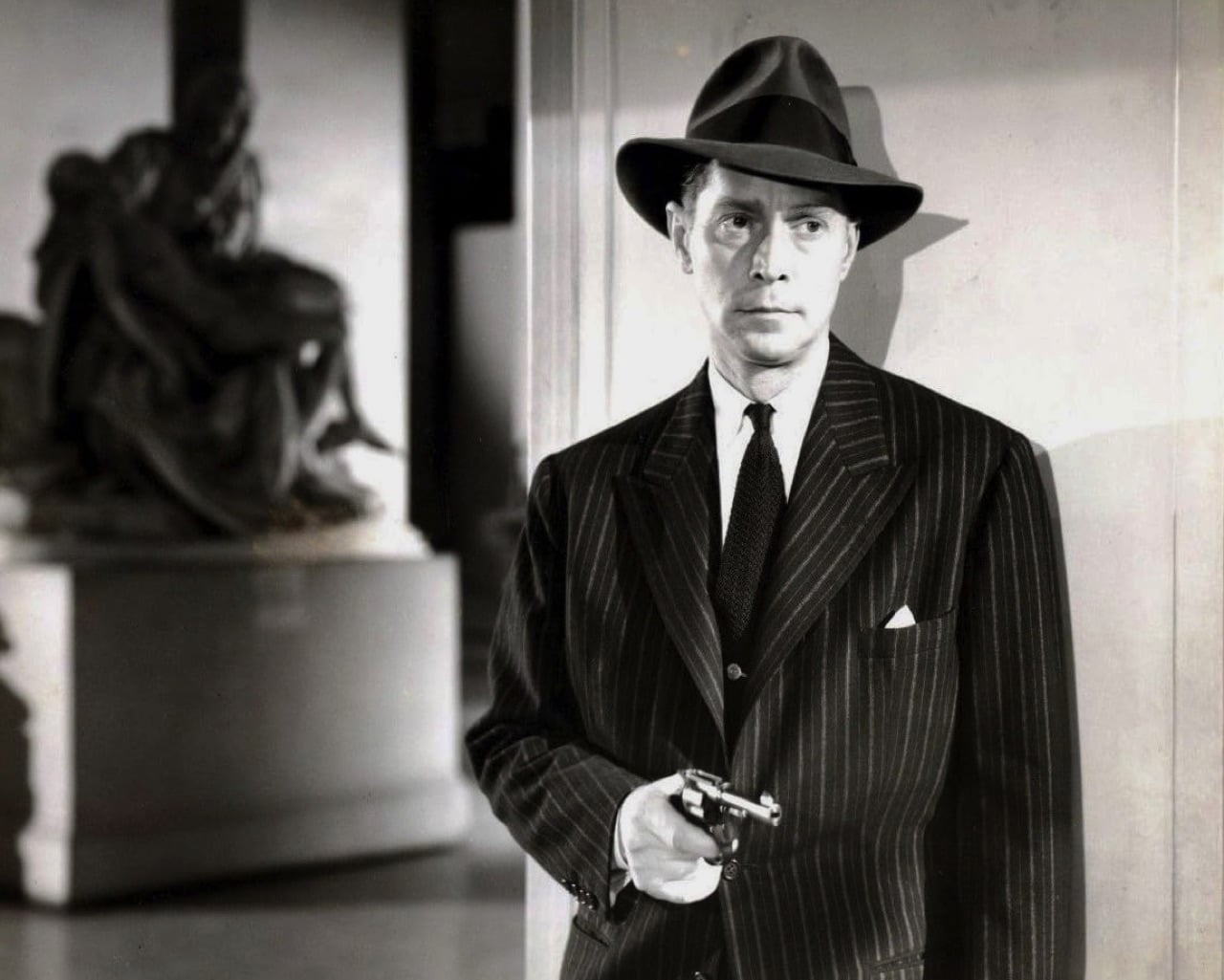 Franchot Tone with gun drawn