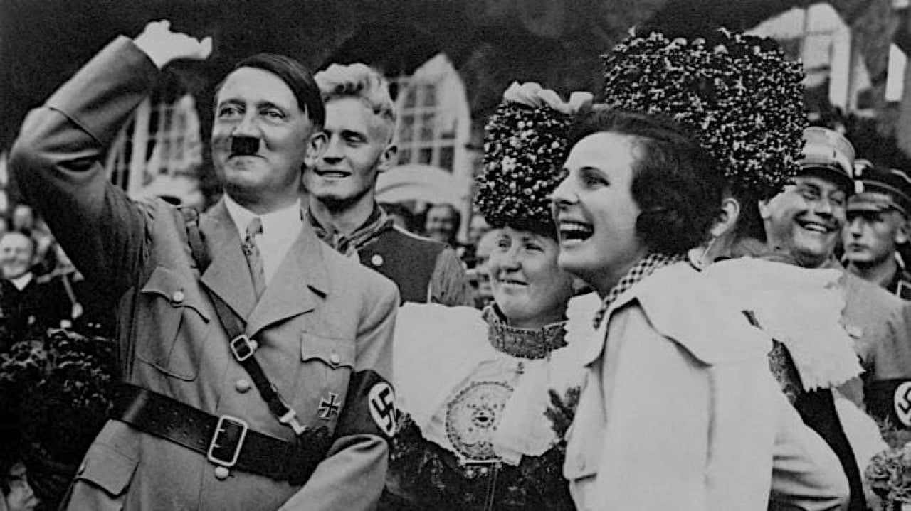A smiling Adolf Hitler with a laughing Leni Riefenstahl