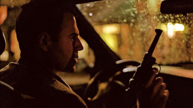 Bruno with a gun in his car