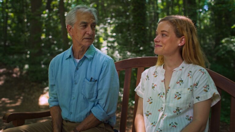 Bill and Tammy sit on a bench together