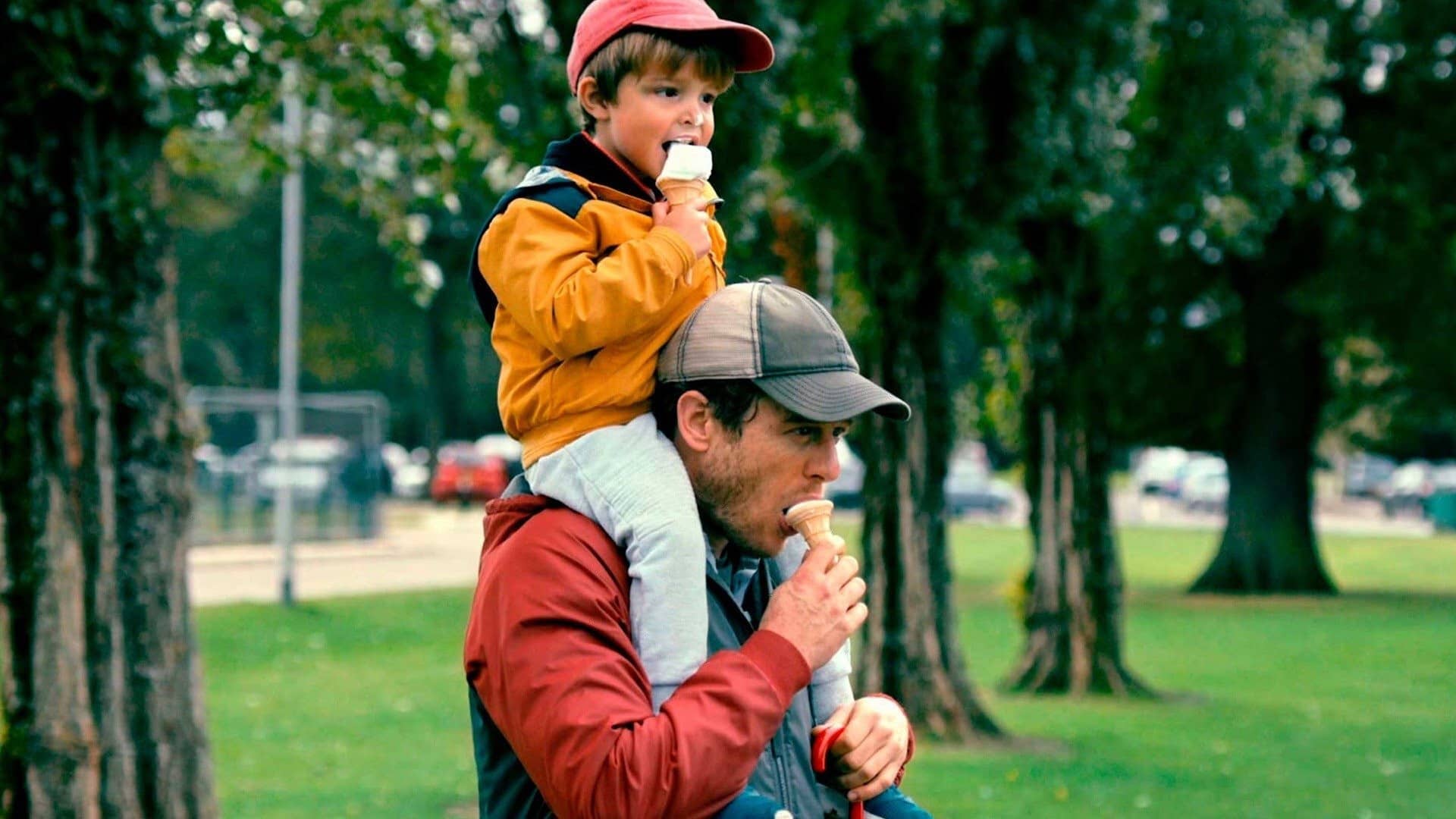 John gives Michael a ride on his shoulders