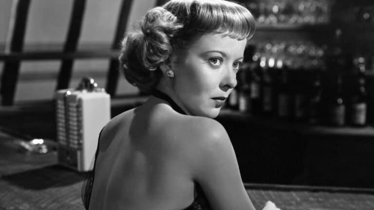 Lily (Ida Lupino) seen from the back