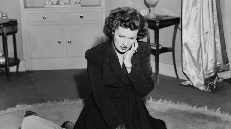 Marian leans over the body of Susan
