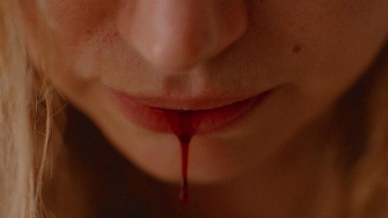 Close up of Lidia's lip bleeding