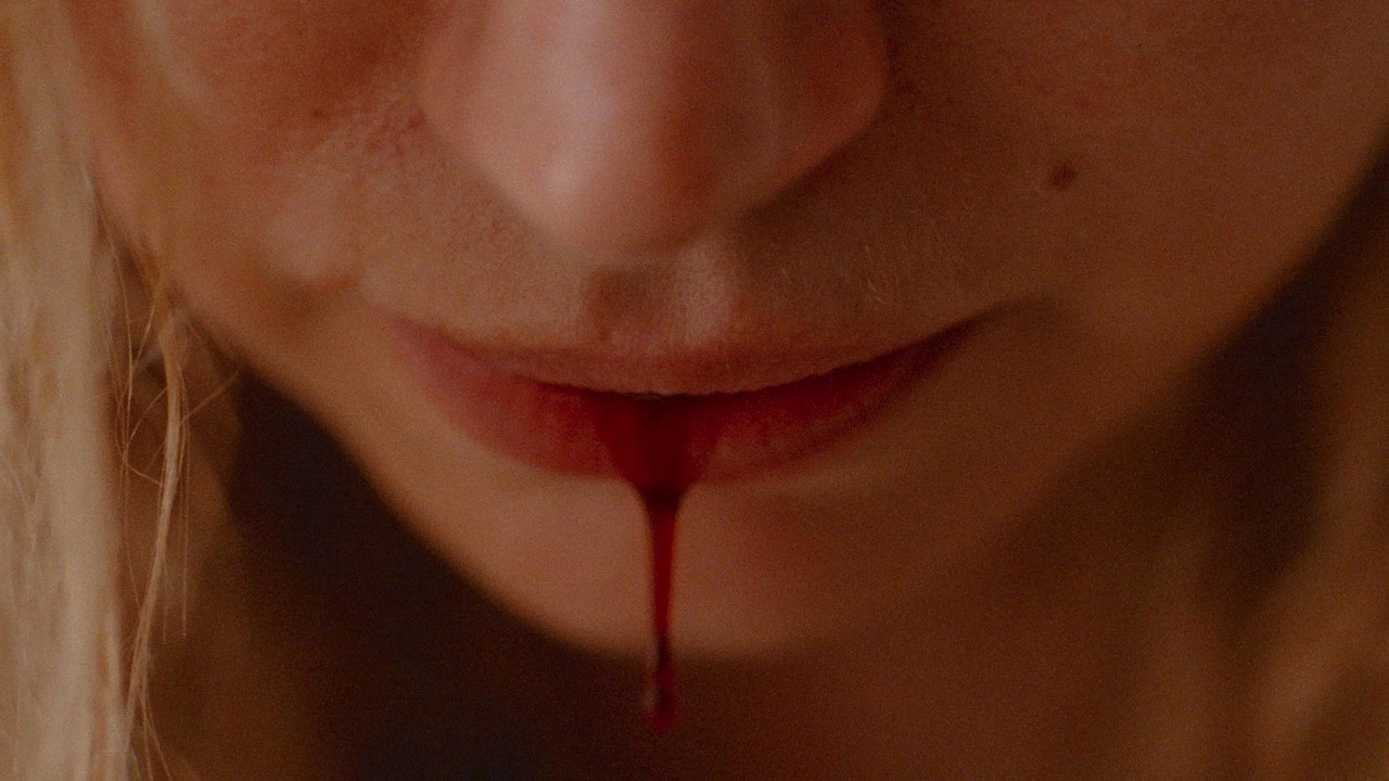 Close up of Lidia's lip bleeding