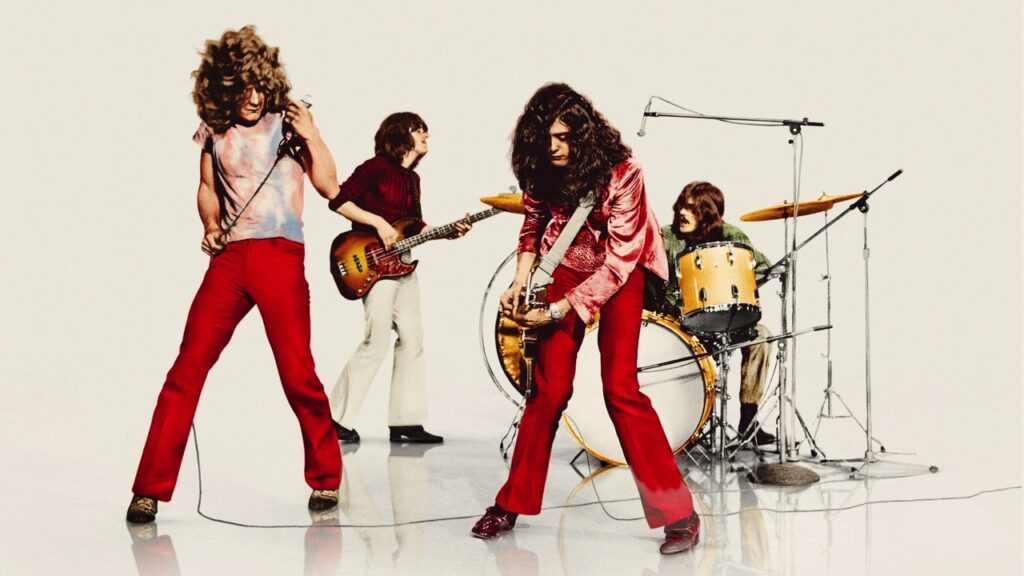 Group shot of the band playing in a studio