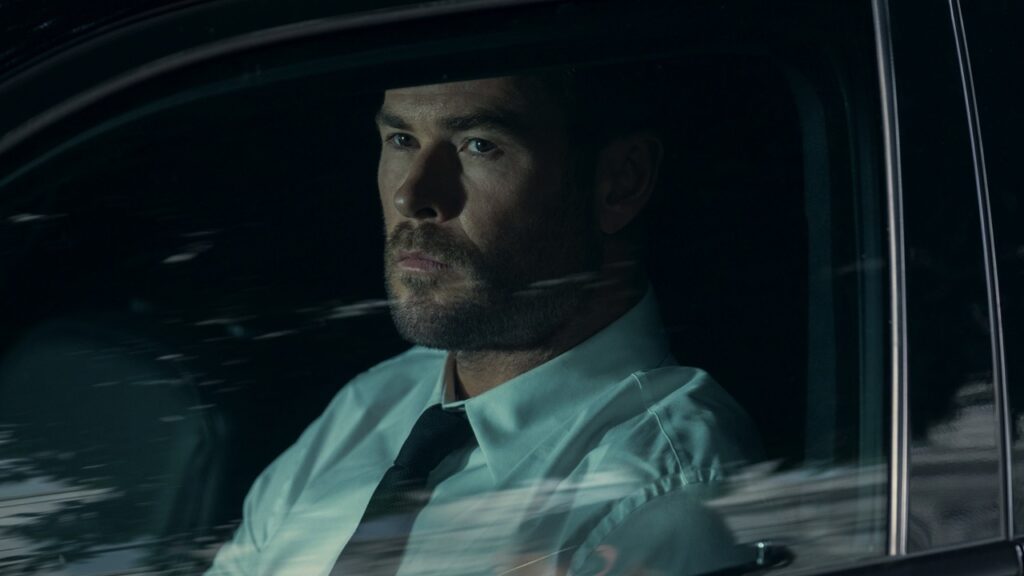 Davis sits in a car quietly