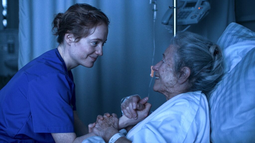 Floria shares a moment with a demented patient