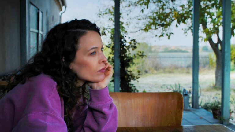 Laura looking thoughtful