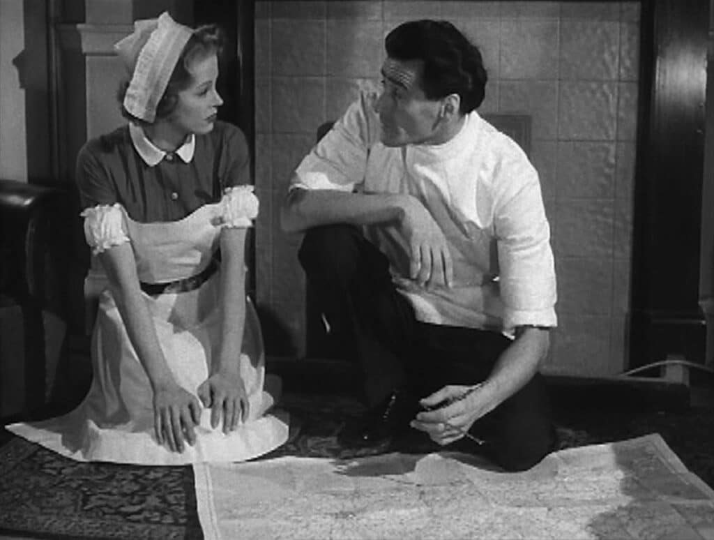 Nurse Rogers and Dr Fenton consult a map