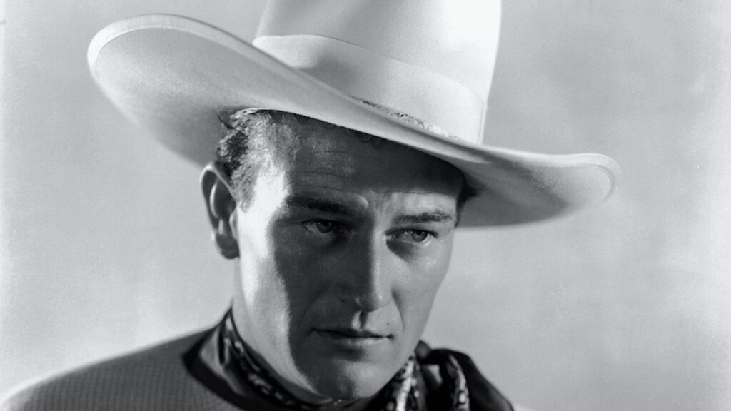 Head shot of John Wayne in white hat