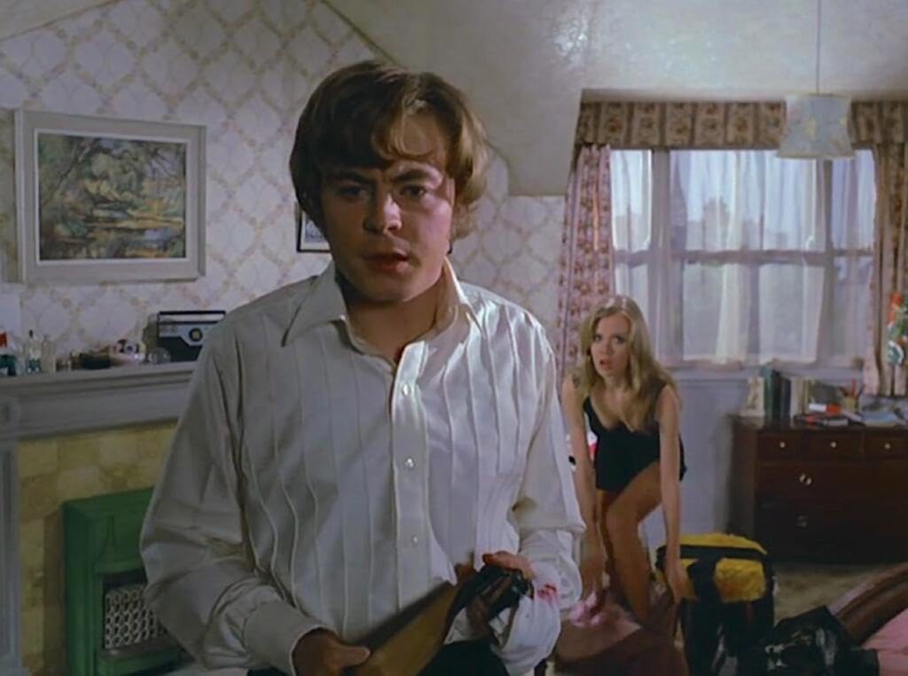 Martin, posing as Georgie, and a semi-dressed Susan
