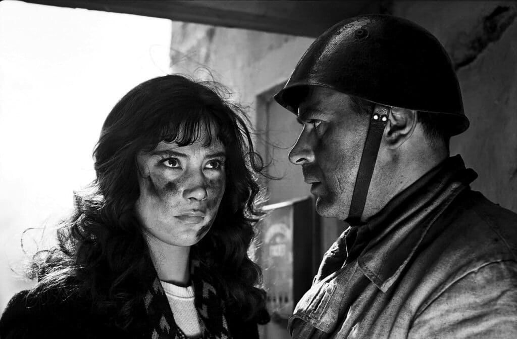 Veronika being told by a soldier that her family is dead