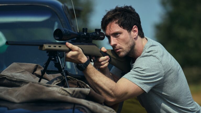 Will Tranter aims a rifle