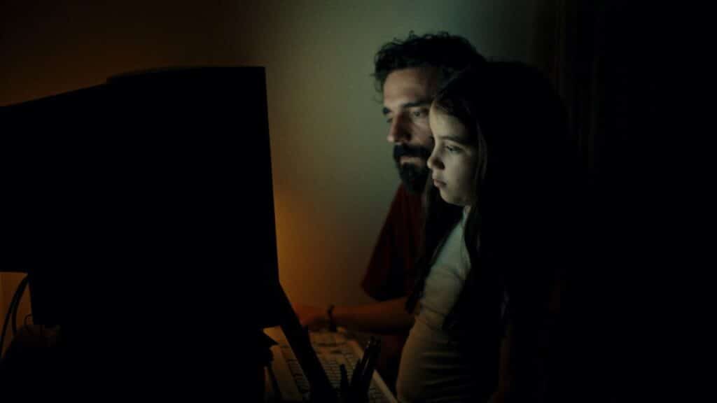 Dad and young Sasha at his computer
