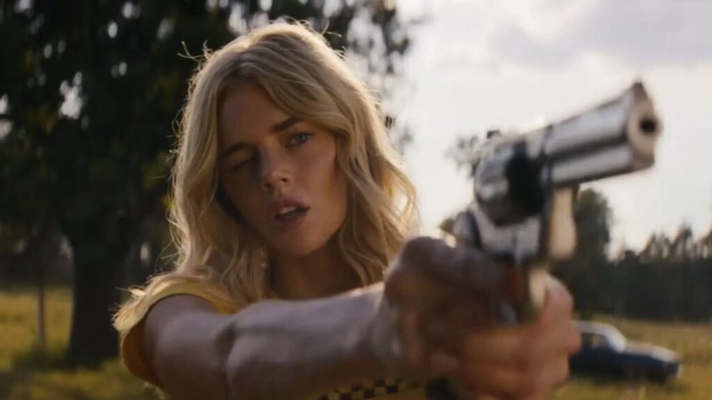 Caroline aims a gun