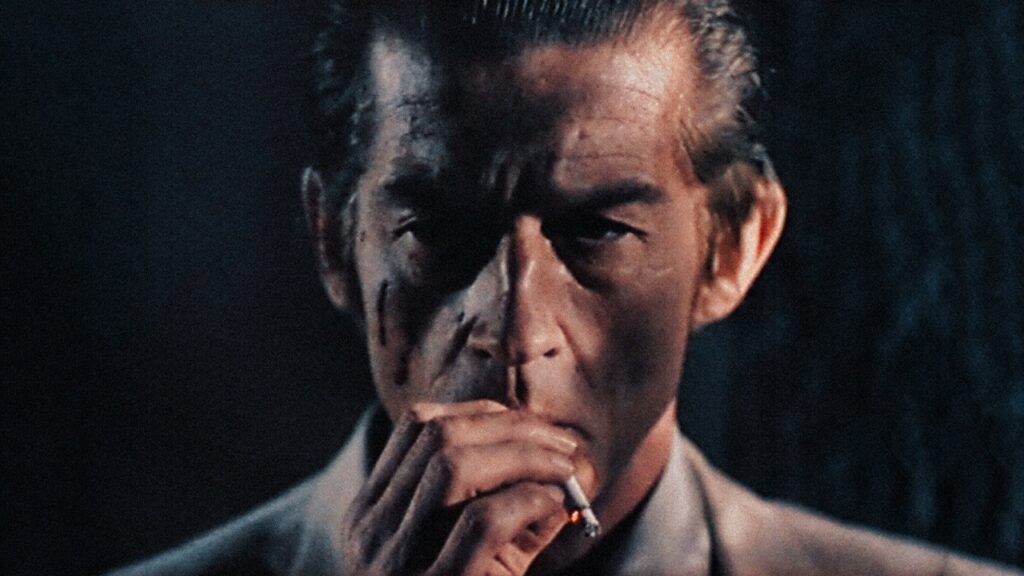 Mr Braddock close up, smoking