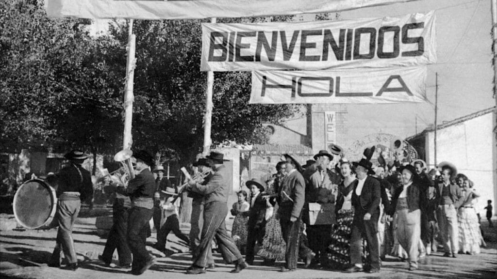 The town gathers for the arrival of the Americans
