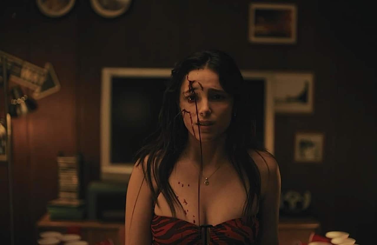 Nikki with blood running down her face