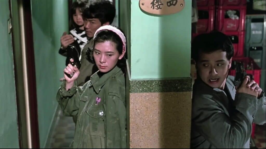 With his kid, Heung and Miss P edge towards a gangster just around a corner