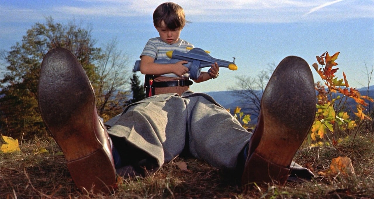 Little Arnie, with his toy gun, finds the body