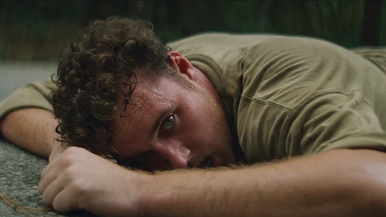 Tyler lying on the ground in despair