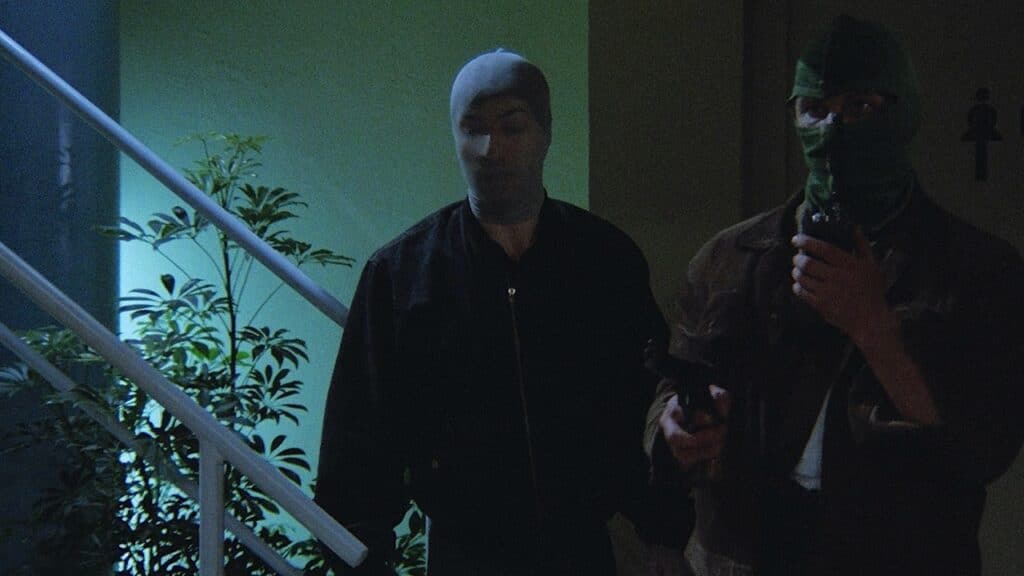 Britz and Junhein in face coverings and carrying weapons